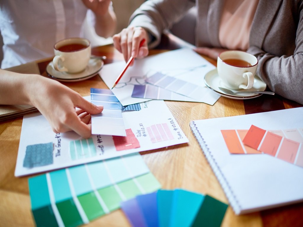 Two working professionals are discussing colour psychology for business.