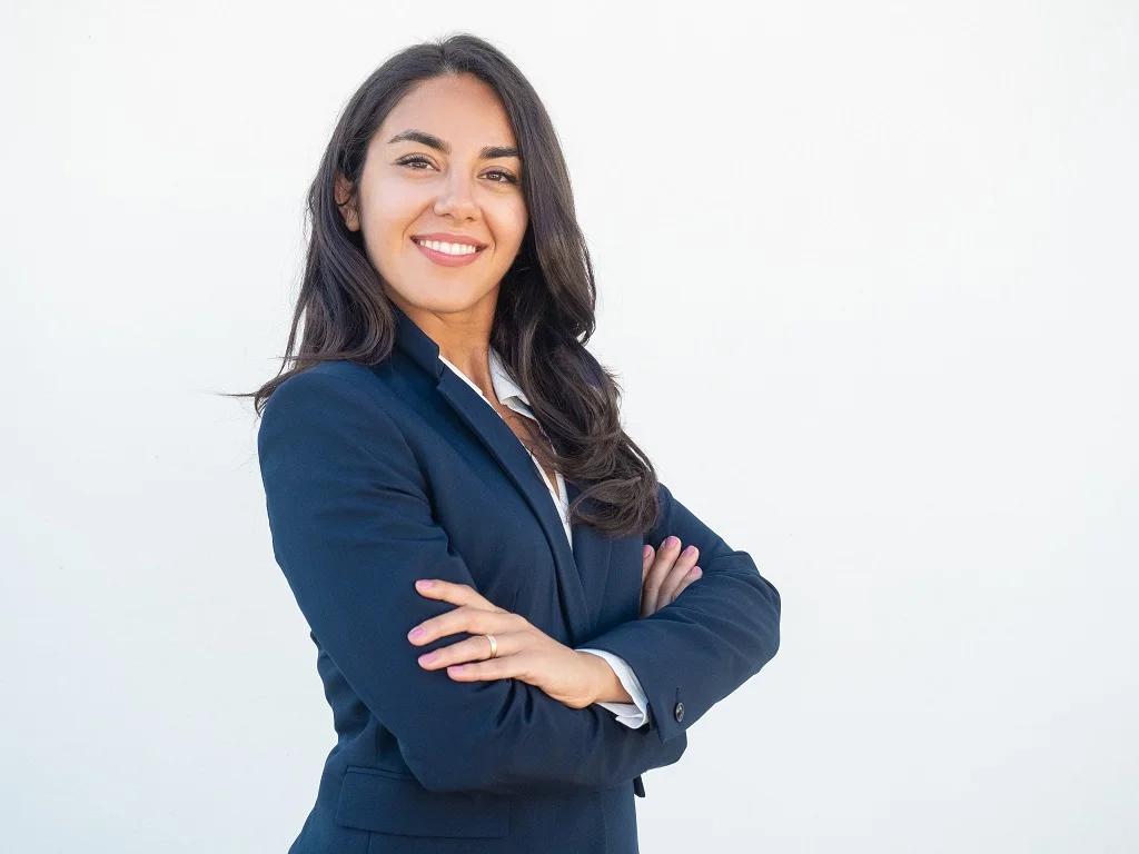 nfident businesswoman posing with arms folded